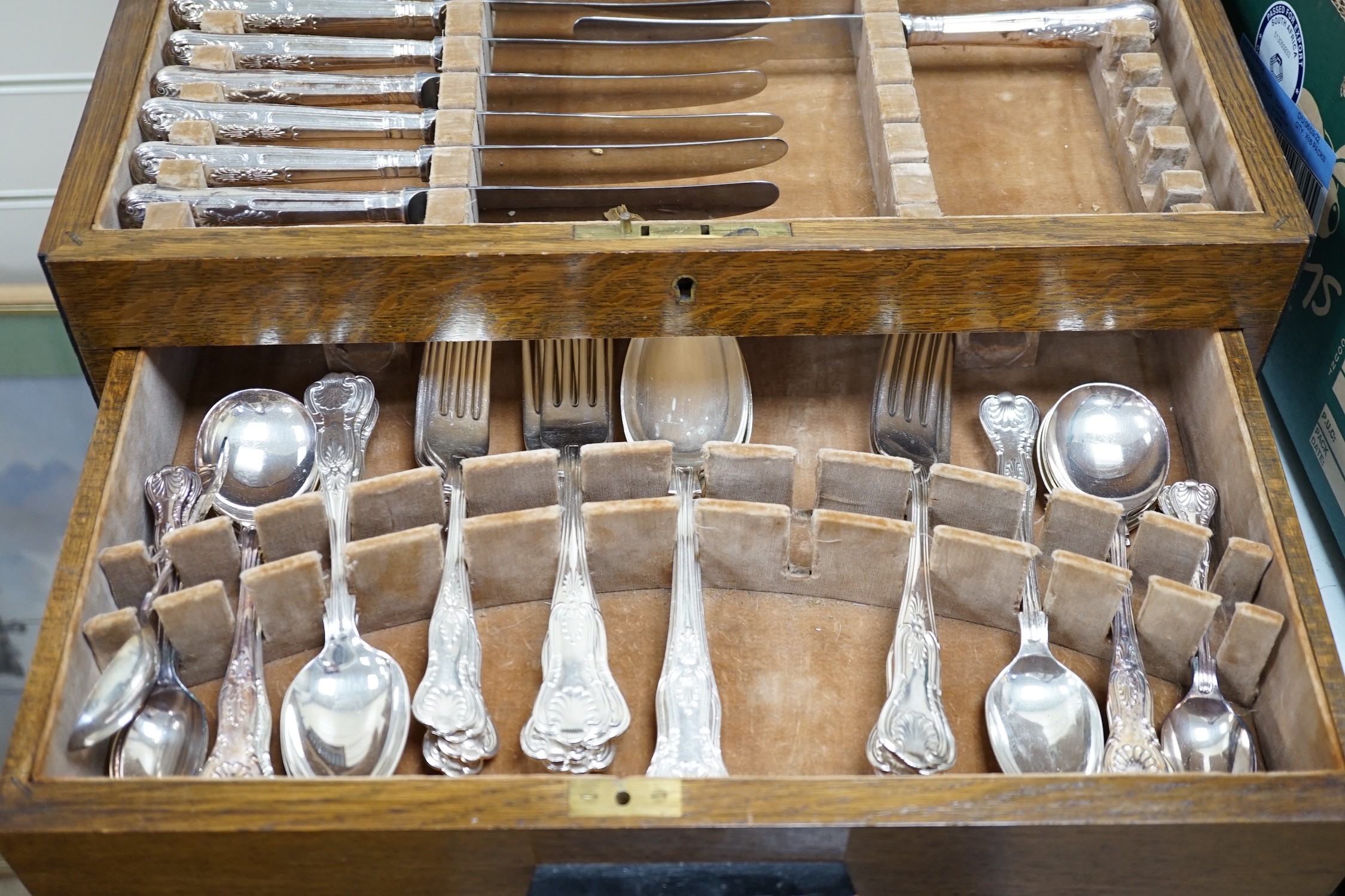 A mid 20th century canteen of Kings pattern plated flatware